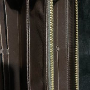 Louis Vuitton wallet , brown color .